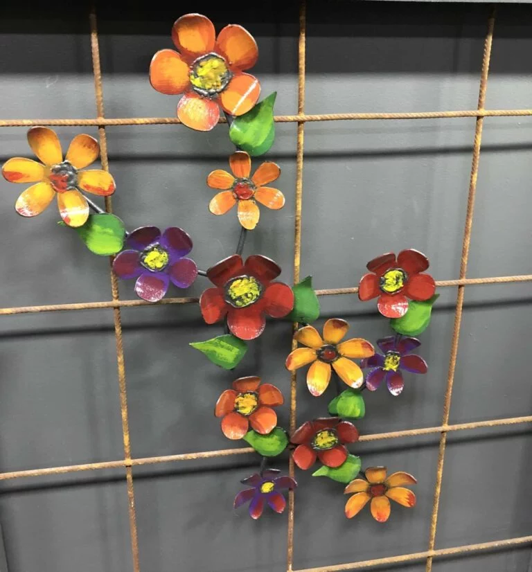 Flower Stem Metal Wall Art: A metal wall art piece featuring a flower stem design